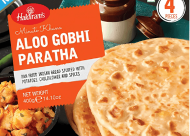 Packaged Aloo Gobhi Paratha from Haldiram's on a Desi Mart branded background